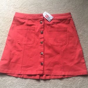 Mini pink denim skirt